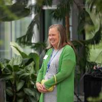 Annie Valkema standing, smiling at something off camera